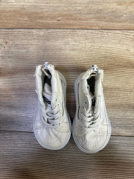 Top view of white Vans Sk8-Hi Zip sneakers in size 3.5C showcasing lace-up fronts and side zippers on a wood-grain background