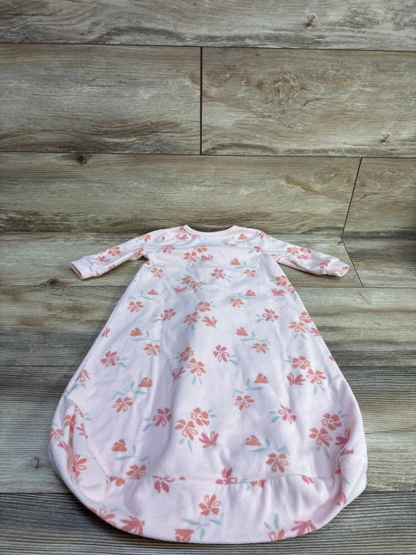 Front view of Just One You pink blanket sleep sack for 3 to 6 months, with floral print and long sleeves on a wood floor