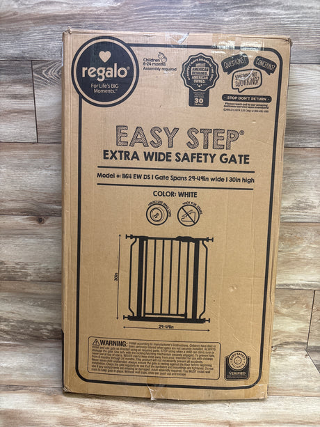 Front view of Regalo Extra Wide Safety Gate box showing white gate, 29 to 49 inch width, and 30 inch height