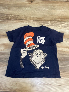 Navy blue kids t-shirt featuring The Cat in the Hat graphic with red striped hat on wood background