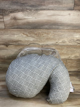 Front view of Boppy Cuddle pregnancy pillow in grey basket weave slipcover in original packaging on wood plank floor