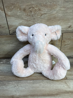 Front view of Cloud Island pink elephant plush showcasing soft fluffy fur and long bendable trunk with wood plank background