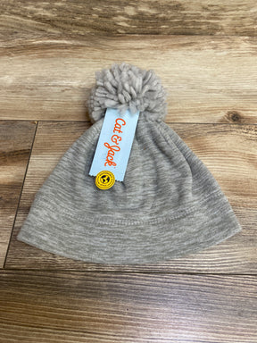 Gray Cat & Jack knit beanie with pom pom on wood floor, eco-friendly style tag