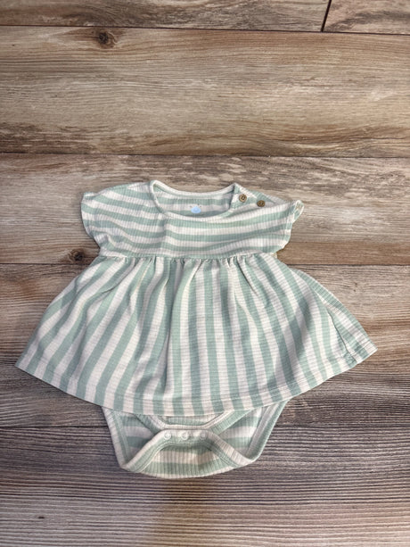 Mint green and white striped baby dress with ruffled sleeves and snap closures on wood floor