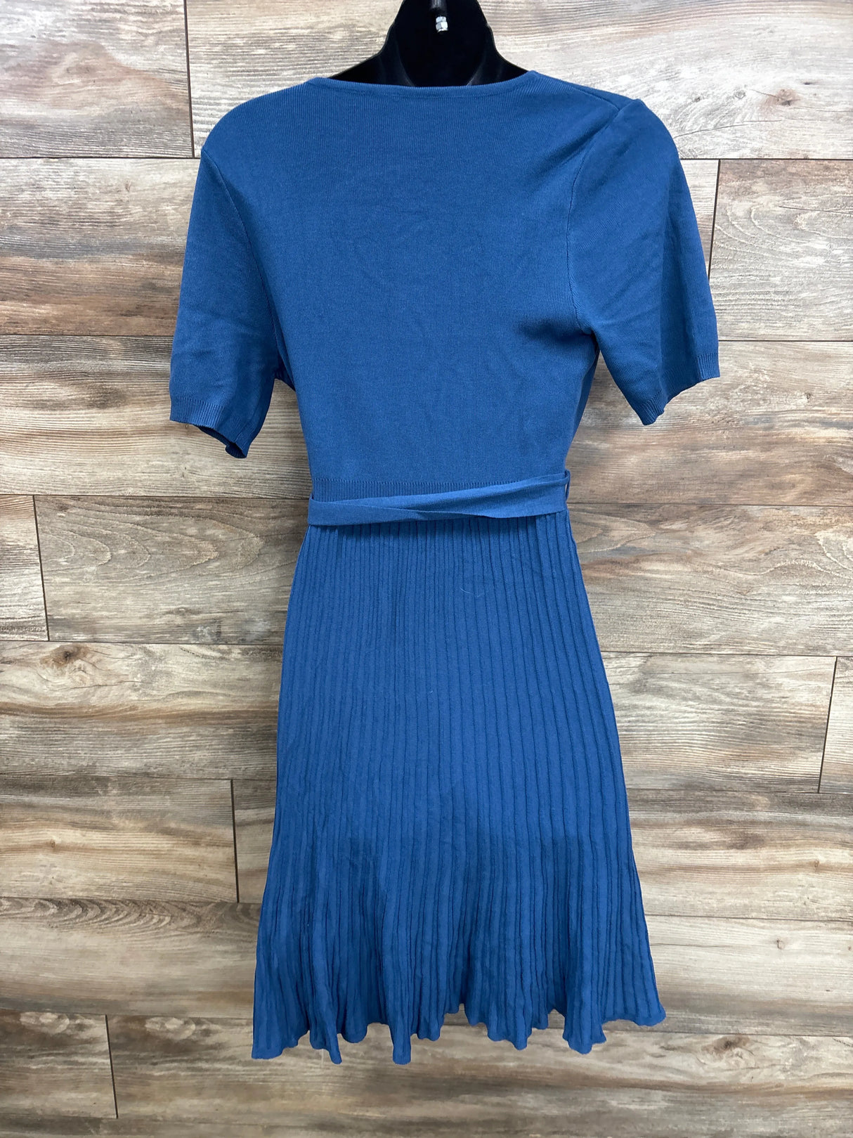 Blue maternity dress with short sleeves, ribbed knit, and pleated skirt for expectant moms