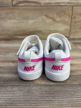 Rear view of Nike Court Borough Low Recraft toddler sneakers showcasing white leather, pink heel stripe and pink NIKE logo on wood floor