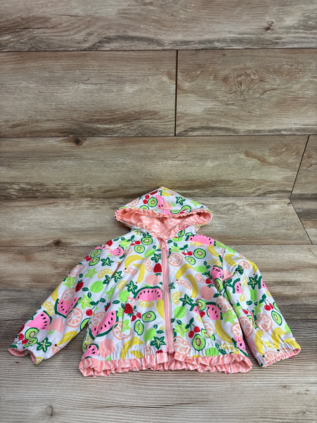 Front view of a white reversible fruit print waterproof jacket in size 3T showcasing a hood, zipper, and ruffled trim on a wood floor