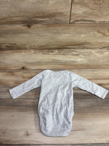 Back view of H&M x Harry Potter Platform 9 3/4 kimono bodysuit in grey with long sleeves on wood
