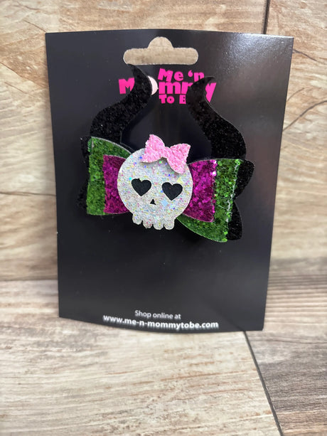 Green and purple glitter hair bow with a skull applique and pink bow, by Me n Mommy To Be