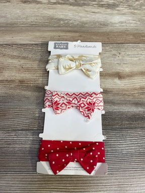 Hudson Baby set of 3 fabric headbands with bows in reindeer, red snowflake, and red polka dot patterns on wood surface