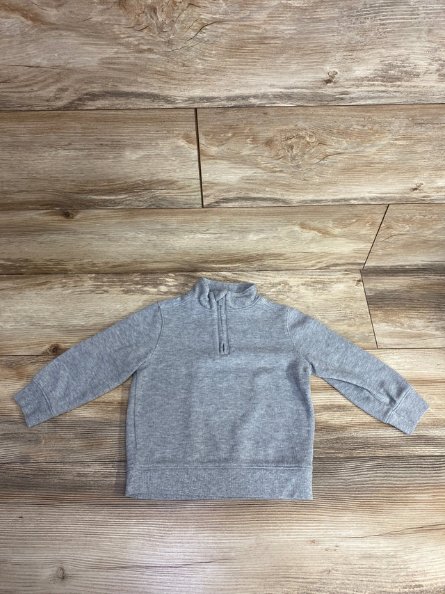 Gray long-sleeve toddler pullover with zip collar on wooden floor, kids clothing