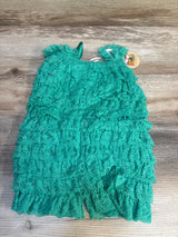 Turquoise ruffled lace baby romper on wood background, gently used kids clothing