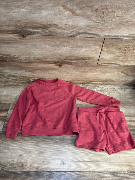 Red kids long sleeve sweatshirt and shorts set on wood floor, gently used children's clothing