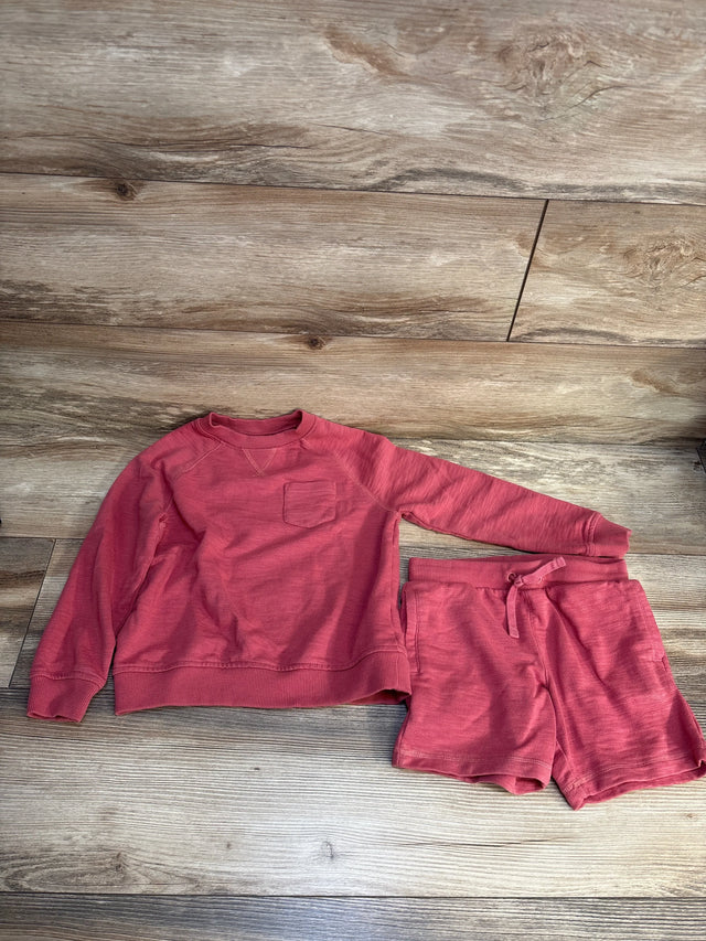 Red kids long sleeve sweatshirt and shorts set on wood floor, gently used children's clothing