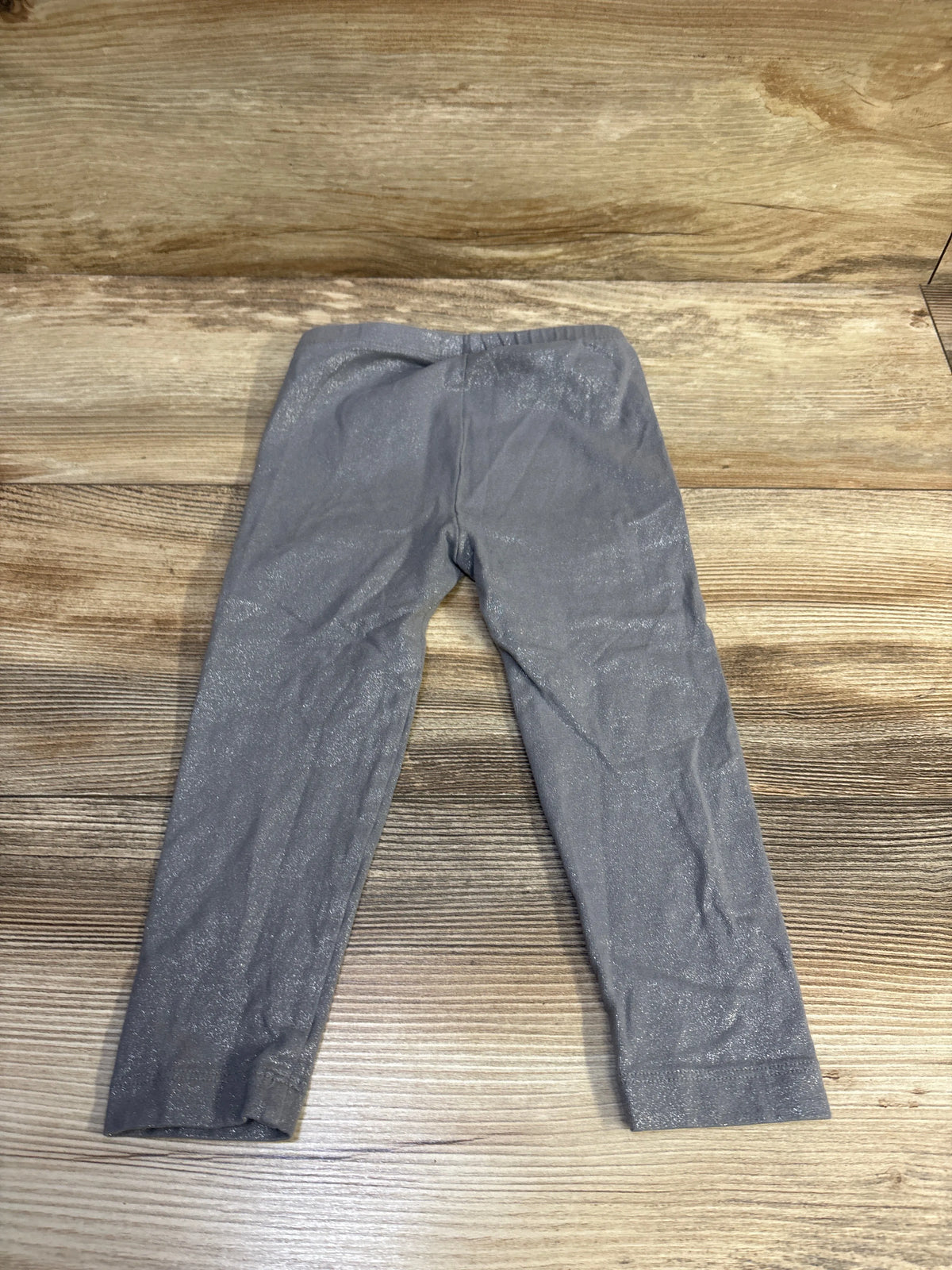 Old Navy glitter grey leggings for toddlers size 2T on a wooden background