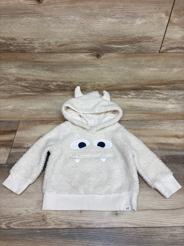 Front view of Baby Gap white sherpa monster 3D hoodie, size 12 to 18 months, with horned hood and zipper mouth