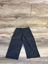 Flat lay of Cat & Jack grey wide-leg joggers size 2T showing drawstring elastic waist and front pockets on wood background