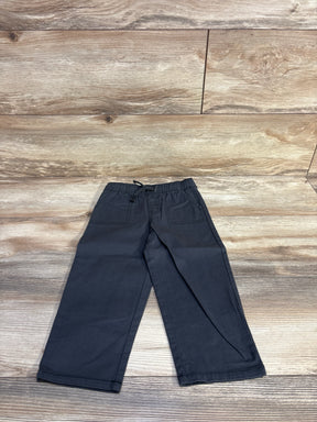 Flat lay of Cat & Jack grey wide-leg joggers size 2T showing drawstring elastic waist and front pockets on wood background