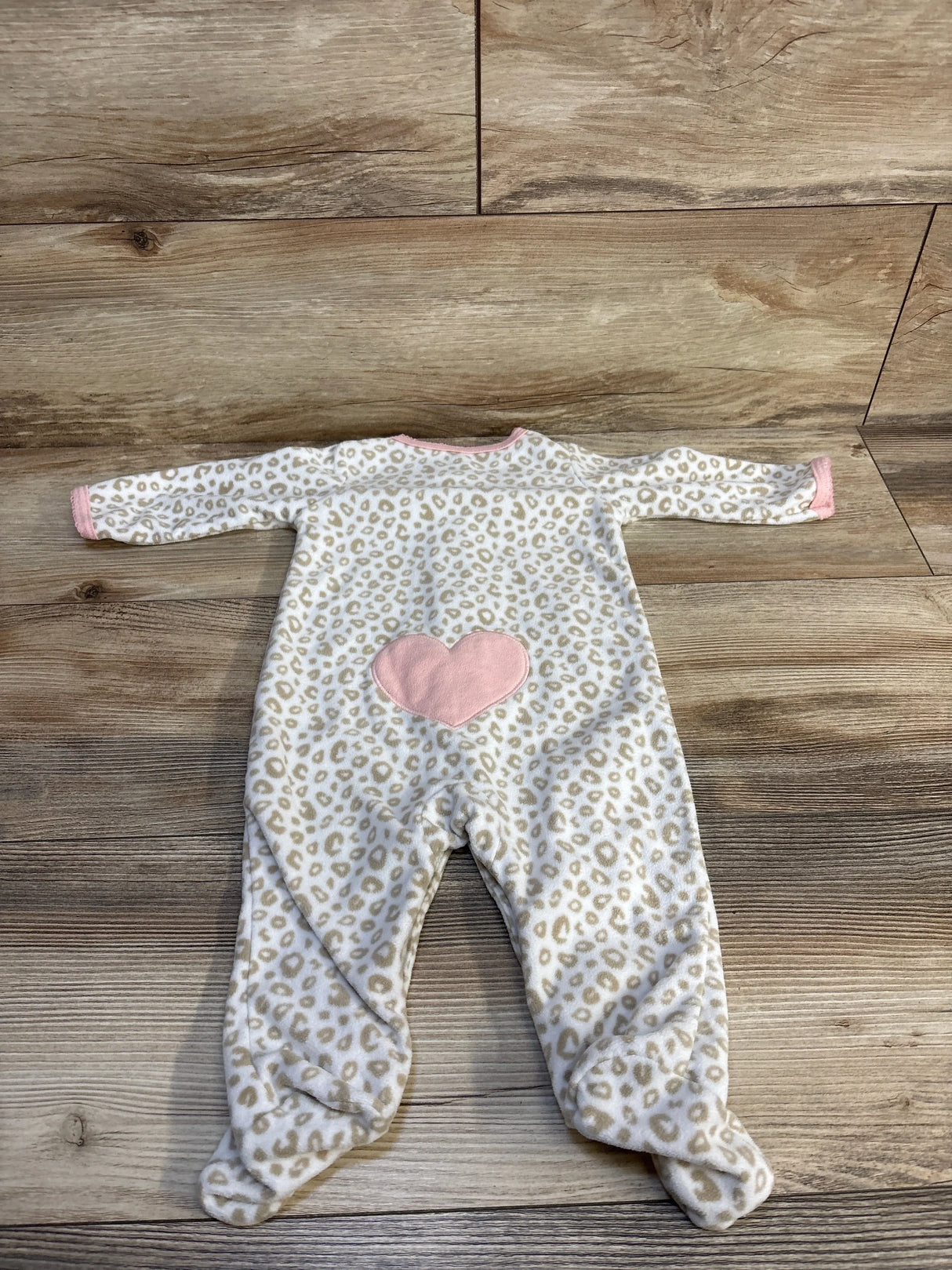 Baby leopard print onesie with pink heart, soft footed sleeper for infants, cozy newborn clothing
