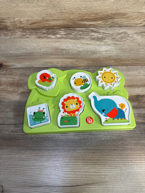 Fisher-Price green animal puzzle toy with lion, elephant, sun, bee, frog, and bird on wood table