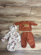 Baby bear print hooded onesie, matching rust pants and sweatshirt set on wooden floor