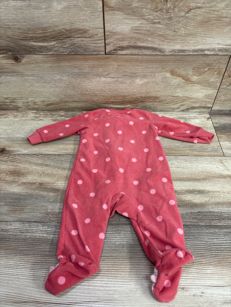 Flat lay of a pink Just One You blanket sleeper with light pink polka dots and covered feet on a wood background
