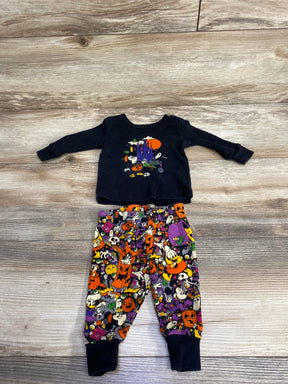Kids Halloween pajama set with spooky castle and cartoon characters on black top and colorful pants