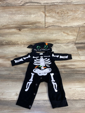 Baby skeleton Halloween costume with 'My first Halloween' bat hat, black long-sleeve onesie, white bones, candy print