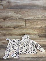 Toddler girl leopard print hoodie and pants set on wood background