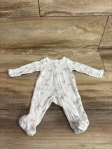 Flat lay of Simple Joys preemie white sleeper showing front zipper and multicolor rainbow print on wooden floor background