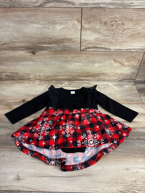 Toddler long sleeve dress with black lace top and red plaid snowflake skirt on wood floor