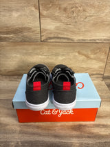 Rear view of Cat & Jack Lucian toddler grey double-zipper sneakers showing red heel tabs and white soles on a Cat & Jack shoebox with wood plank background