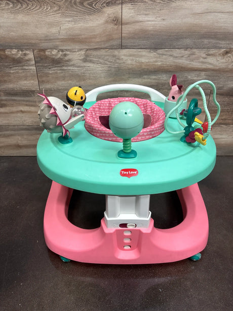 Front view of Tiny Love 4-in-1 Here I Grow Activity Center in Tiny Princess with pink seat, turquoise tray, and toys
