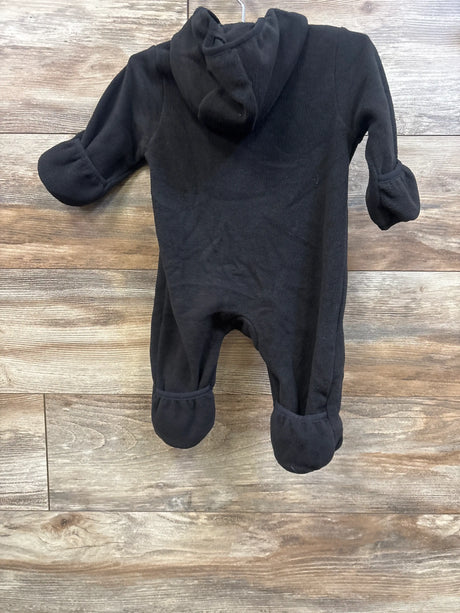 Front view of Wonder Nation black fleece bunting with hood, enclosed mittens and foot covers on a wood floor