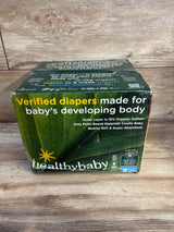 Front view of Healthybaby size 3 diaper box (56 ct) showing headline Verified diapers made for baby's developing body and 15% organic cotton claim on a wooden tabletop
