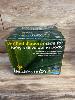Front view of Healthybaby size 3 diaper box (56 ct) showing headline Verified diapers made for baby's developing body and 15% organic cotton claim on a wooden tabletop