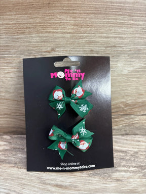 Green Santa-themed hair bows for kids, festive holiday accessory on black card