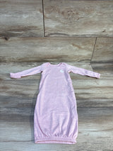 Pink long-sleeve baby sleeper gown with bunny detail on wooden background