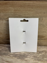 Front view of 2-pack yellow hair bows display card showing two silver alligator clips on wooden surface