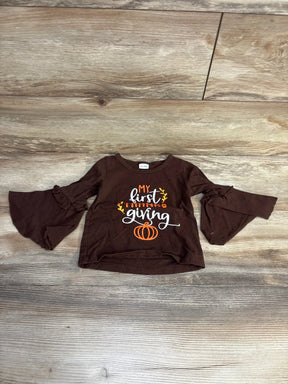 Brown baby shirt with bell sleeves and Thanksgiving-themed text My first Thanksgiving and pumpkin graphic