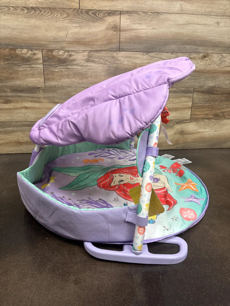 Front view of Bright Starts The Little Mermaid Twinkle Trove activity gym with purple padded mat, canopy, and toy bar