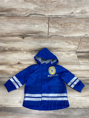 Front view of blue toddler hooded windbreaker with reflective silver sleeve and hem stripes and POLICE badge on wood floor