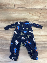 Flat lay of navy Simple Joys newborn footed blanket sleeper with dinosaur print and front zipper on wood floor
