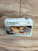 Honest clean conscious diapers pack size 2, 32 count, on wood floor