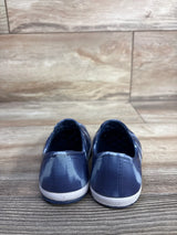 Rear view of Cat & Jack toddler blue slip-on water shoes showing tie-dye pattern and white textured sole on wood floor