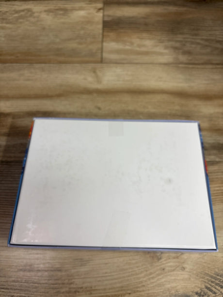 Back view of zhiseoyi 300pc Jigsaw Puzzle Dogs box showing its blank white back on a wooden surface