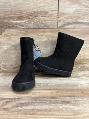 Black suede kids ankle boots with side zipper on wood background