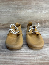 Front view of Piper Finn low-top oxford baby shoes, tan size 6C, showing white laces and leather upper on wood background