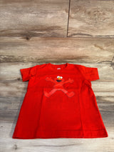 Front view of Uniqlo Kaws Elmo toddler red T-shirt size 5/6T on wood background showing Elmo graphic