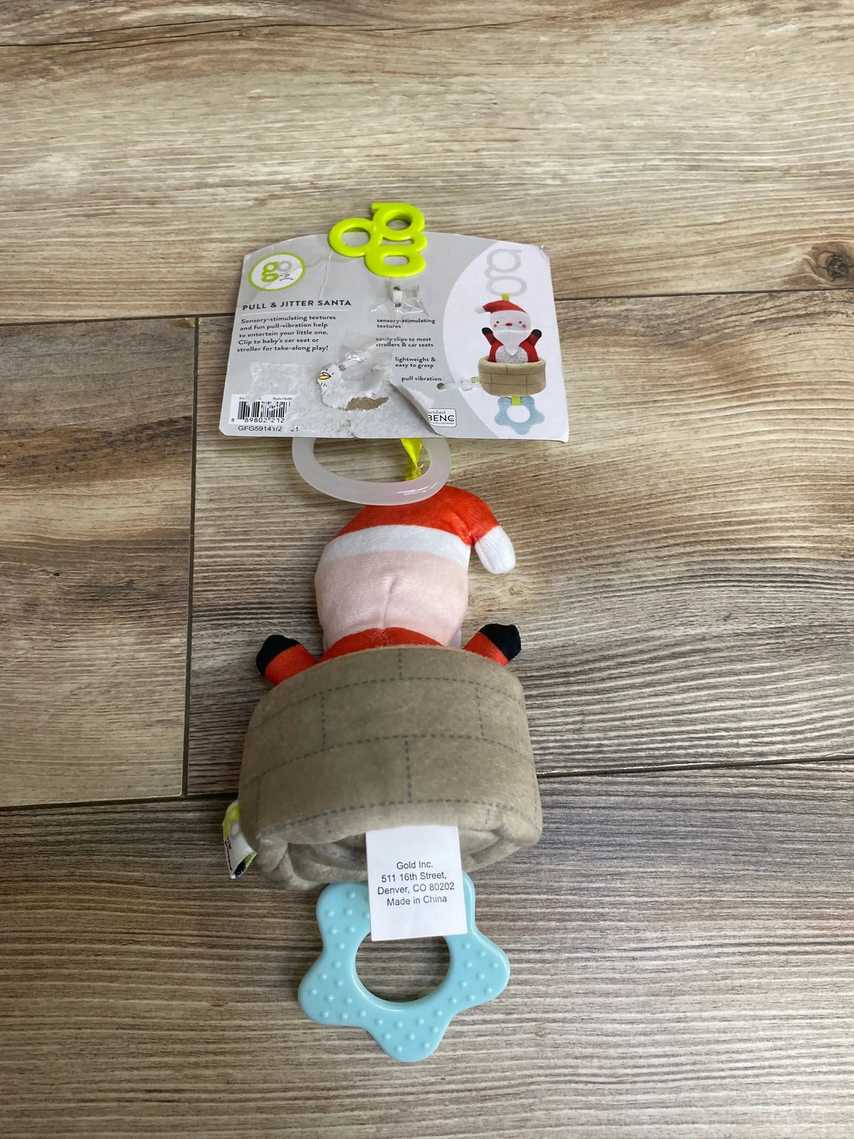 Santa-themed baby toy with sensory textures and teether, perfect for strollers or car seats